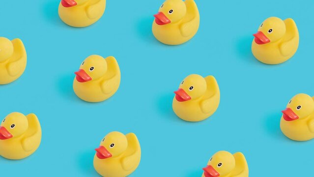 Simple concept with yellow  rubber duck toys. Loopable  4k video.