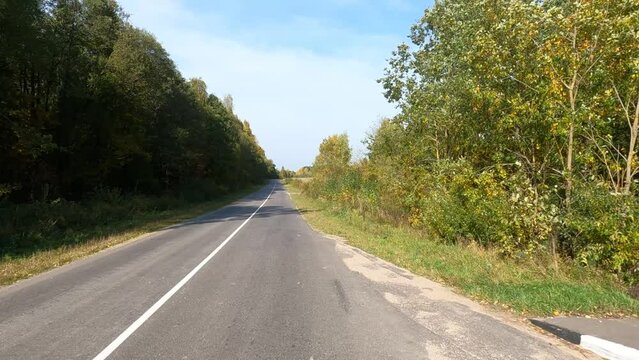 Road view on a summer day. Highways and cars, roadside and white road line markings.