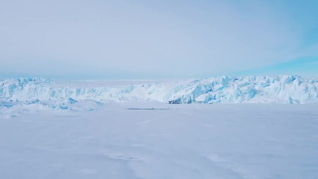 Snow covered antarctic surface aerial view flight. Frozen south pole. Desert white land of snow and ice drone shot. 