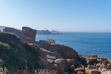 Bizarre boulders and rock formation with blue sea on the Cote de Granit Rose near Ploumanac'h,...