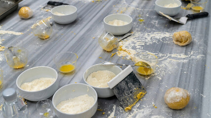 Table full of messy ingredients while baking. Creative mess in the kitchen after cooking