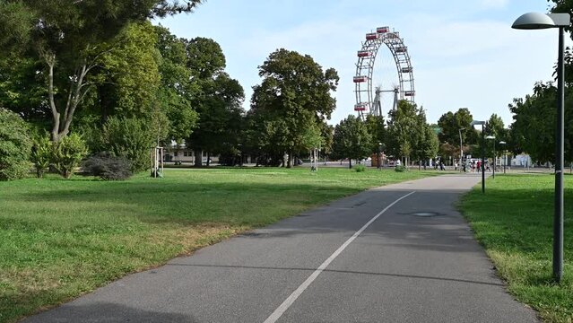Vienna, Austria, August 2022. As you approach the city's large amusement park, the Prater, you immediately notice the large vintage Ferris wheel.