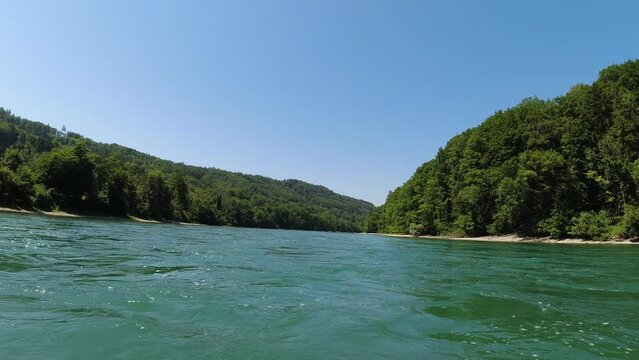 river tubing tour on a blue river with lush green forest in bright sunshine