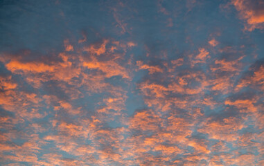 Red clouds at sunset in the blue sky