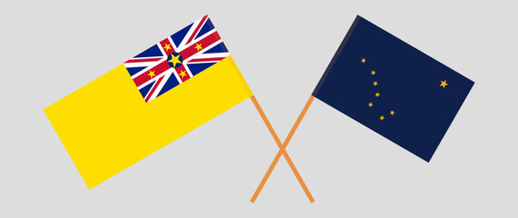 Crossed flags of Niue and the State of Alaska. Official colors. Correct proportion