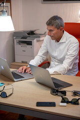 Man working in the office with his modern laptop