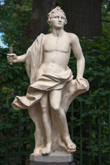 Statue of young man in Summer garden, Saint Petersburg, Russia