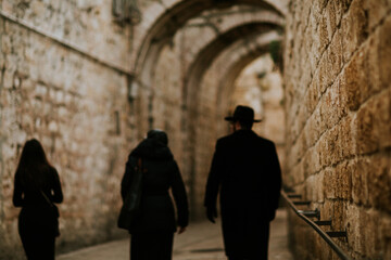 Fototapeta na wymiar Jewish people walking in street, old city jerusalem