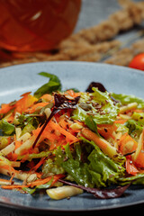 Sicilian salad with fennel, oranges, grapefruit and radicchio salad with balsamic dressing on a blue linen tablecloth. healthy summer italian food