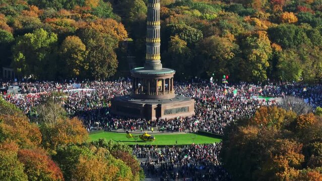 Crowded square around Victory column in Tiergarten park. Protest rally against Iranian regime. Berlin, Germany
