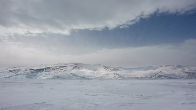 Clouds timelapse over a frozen lake in winter. &Ccedil;ıldır Lake in Ardahan city, Turkey.