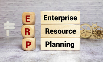 ERP message on tablet pc screen held by businessman hands - concept, top view computer, phone...