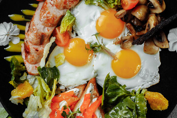 Full English breakfast with toast bread, chicken egg, mustard sauce, champignons, salad mix, cheese cream, sweet pepper