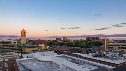Aerial Lockdown Time Lapse Shot Of Clock Tower In University Of Michigan Under Cloudy Sky - Ann Arbor, Michigan - Powered by Adobe