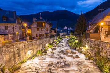 night falls on the picturesque river of vielha, at the foot of the pyrenees valley of arán spain
