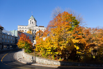 Low angle view of De La Montagne street with its steep downhill curve seen during a sunny Fall day, Quebec City, Quebec, Canada