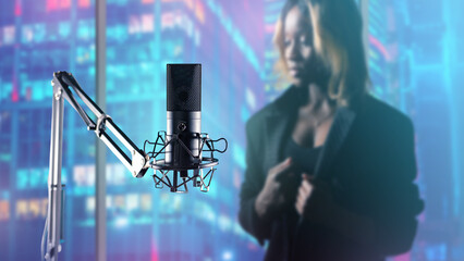 Microphone for recording studio. Woman performer of jazz music blurred. Recording studio equipment....