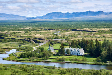 View of Thingvellir National Park, Iceland showing Thingvellir Church and Thingvellir House on the Oxara River.