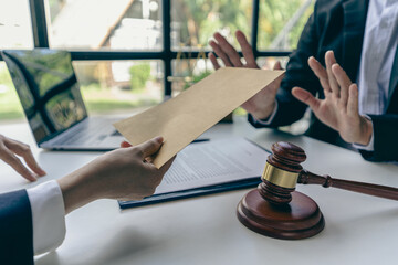 Businessman holding a cash envelope to bribe a participant's corrupt idea. lawyer gets money But he...