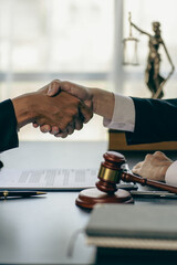 Businessmen shake hands to seal a deal with a partner lawyer or a lawyer who discusses contract agreements, advice, legal services.