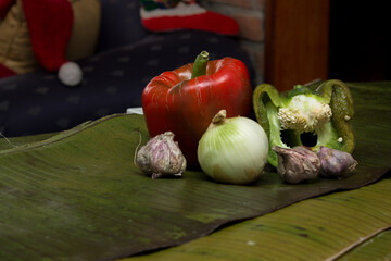 Venezuelan Christmas gastronomy, vegetables and a roll of white thread on banana leaves for the preparation of hallaca, a typical dish to celebrate Christmas