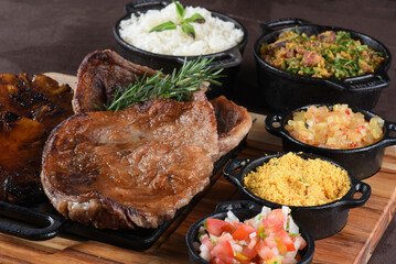 barbecue roast beef with rice, boiled cassava salad, farofa and beans, typical Brazilian cuisine