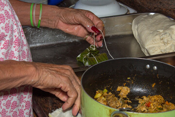 Venezuelan Christmas gastronomy, details of the preparation of a hallaca