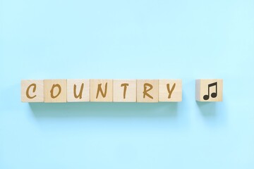 Country music genre or style concept. Creative flat lay typography composition in blue background.