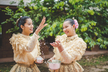 Portrait beautiful women in Songkran festival with Thai Traditional costume