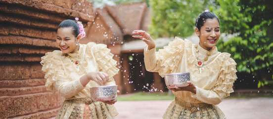 Portrait beautiful women in Songkran festival with Thai Traditional costume