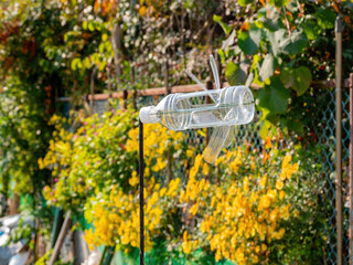 Close up shot of a simple plastic bottle anemoscope