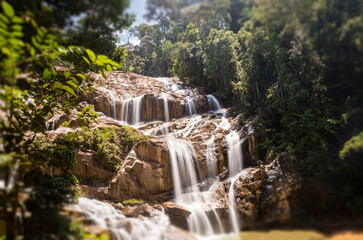 Scenery of Sungai Pandan Water Fall. Long exposure photography of a rainforest water fall. Waterfall in tropical forest at Malaysia. Beautiful waterfall in the forest. Soft water flow.