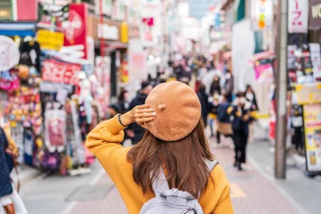 Deurstickers Young woman traveler walking on the Takeshita street in Harajuku the center of teenage fashion and cosplay culture in Tokyo © Kittiphan