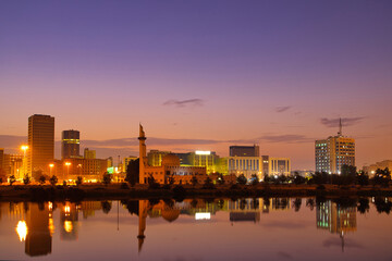 Jeddah, Saudi Arabia, sunset over the corniche and the buildings that are reflected in the sea