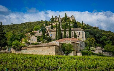 View on the medieval village of Lussan, with vineyards in the foreground in the south of France...