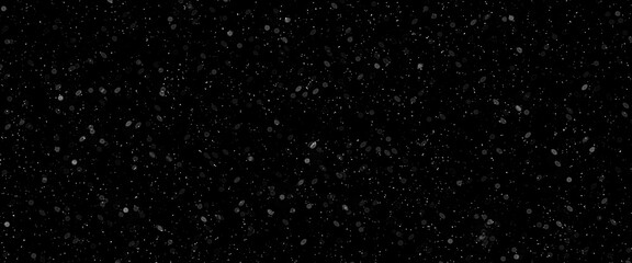 Snowfall bokeh on dark foundation. Numerous snowflakes in flying in the air. Winte night snowfall and snowstorm of snow at. Obscure bokeh light impact innovative foundation.