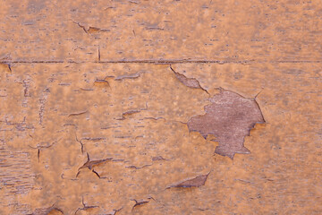 Old wooden wall with peeling paint.
