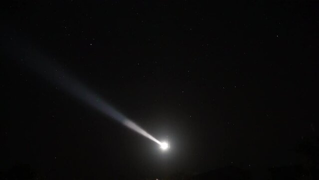 Niigata,Japan - October 20, 2022: Sawasakihana lighthouse beam on stars background in Sado, Japan
