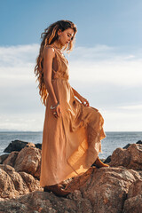 Beautiful young stylish woman on the beach - 540604605