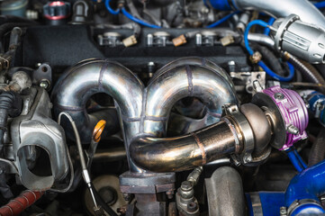 Welding fabrication stainless steel turbo and wastegate manifold header ,exhaust manifold in turbocharged racing car.