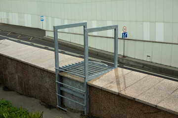 Stairs down wall. Steel staircase on bridge. Infrastructure details.