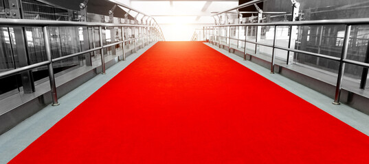 Red carpet entrance with two side handrails