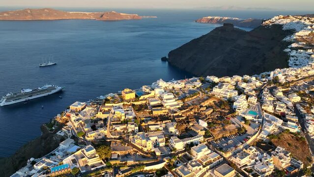 Santorini aerial view, sunrise on Greek islands, vacation in Greece, holiday destination in the Mediterranean