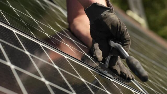 Hand Tighten Consumer Solar Panels, Close Up, Green Power, Energy Transition