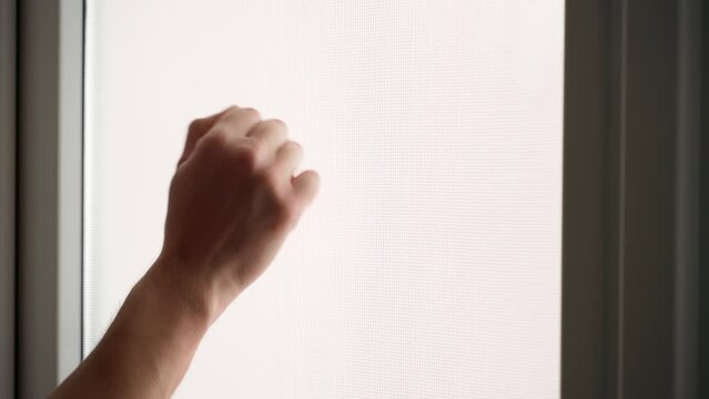 Hand knocking on the window close-up. Fist knocking on the door