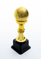 Golden basketball trophy on white background