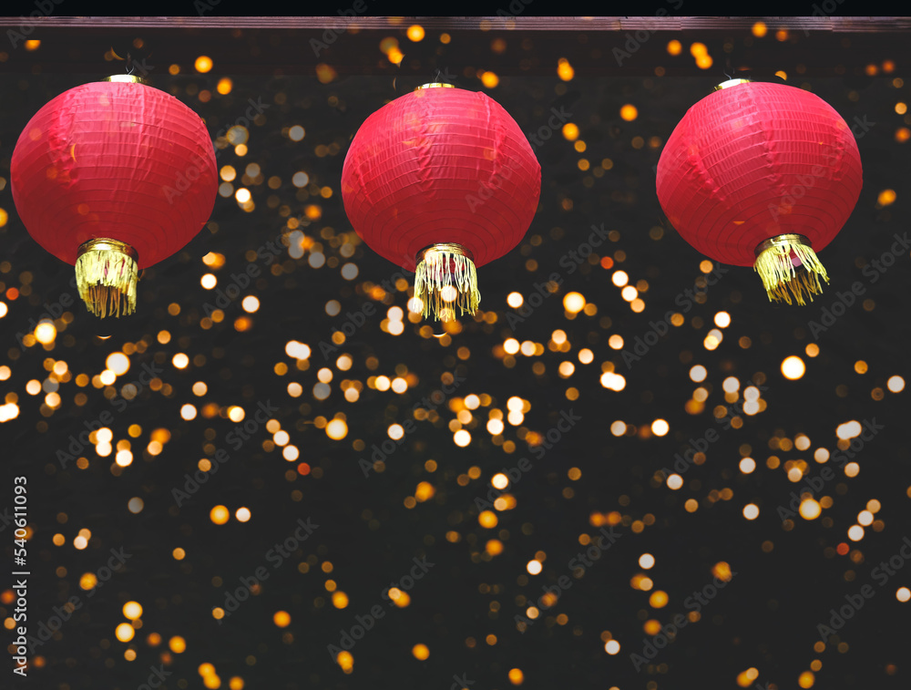 Poster red paper lanterns on dark background with sparkles. concept of chinese new year. close-up