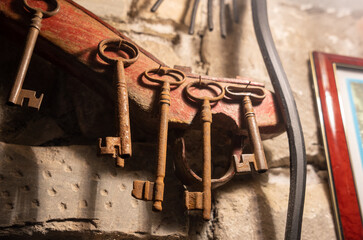 Old rusty keys displayed on the streets of a old Italian farm house. 