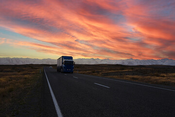 The  sunset scene with traveling  explore on the road with mountain range near Aoraki Mount Cook and the road leading to Mount Cook  in New zealand.
