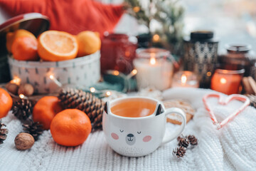 Cute cup of hot steaming tea in the New Year atmosphere, aesthetic photo